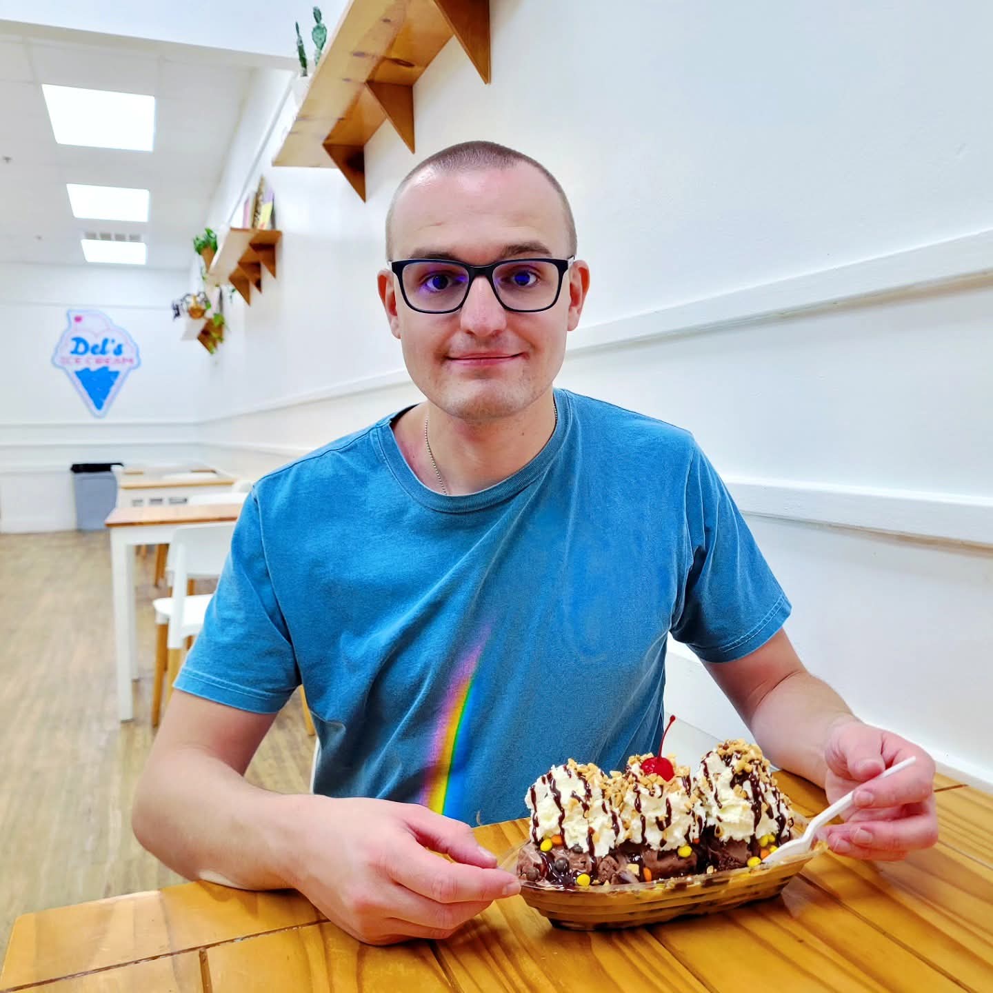 2025-09-22 1957 hours #2 - Brady enjoys a Peanut Butter Lover Banana Split at Del's Ice Cream in Orange Beach