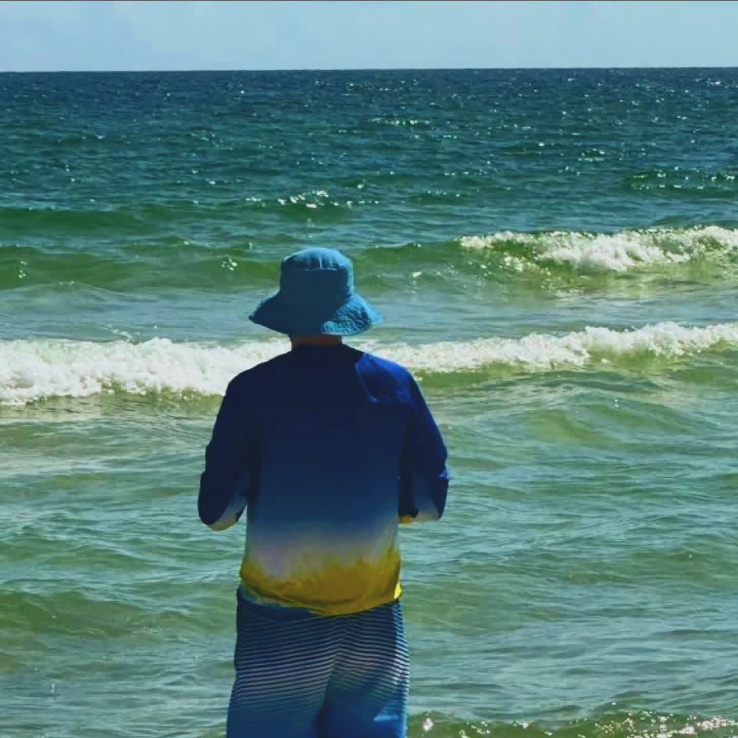 2025-09-23 1456 hours - Brady at the Beach in Orange Beach, Now Wearing Newly Bought Souvenir Hat & Sunproof Shirt