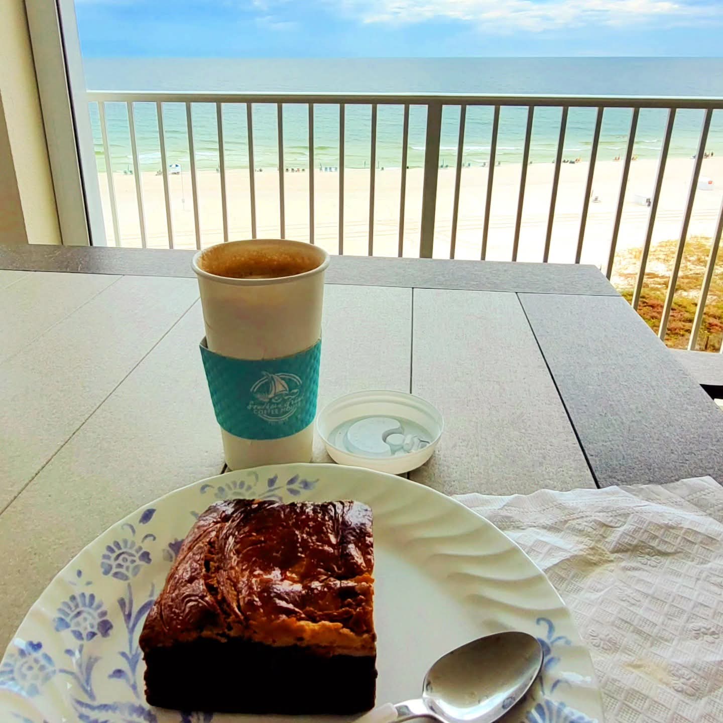 2025-09-25 1256 hours - The Southern Grind's Peanut Butter Mocha Latte & Cheesecake Brownie with a View of the Beach