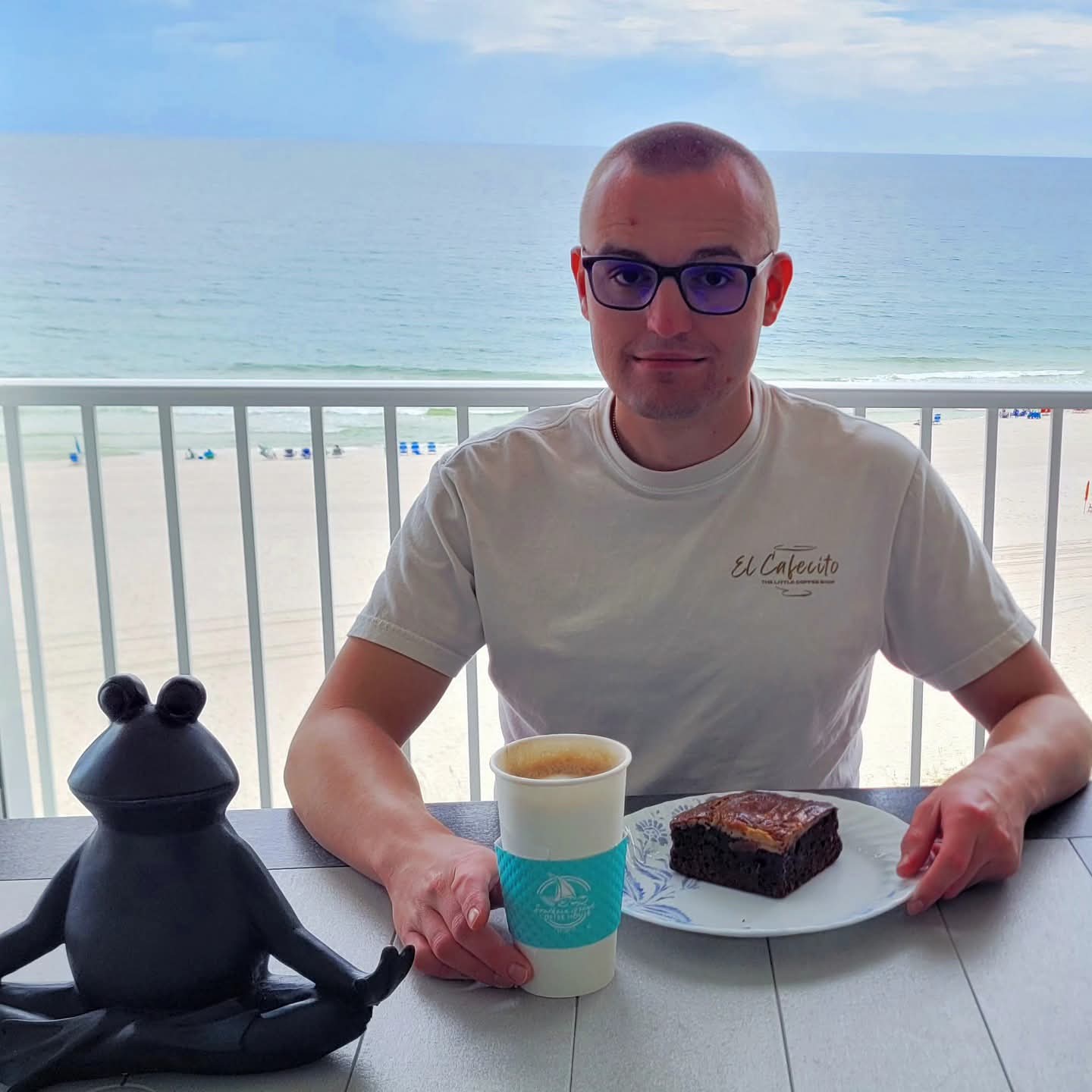 2025-09-25 1257 hours - Brady enjoys his Coffee & Treat from The Southern Grind at the Balcony