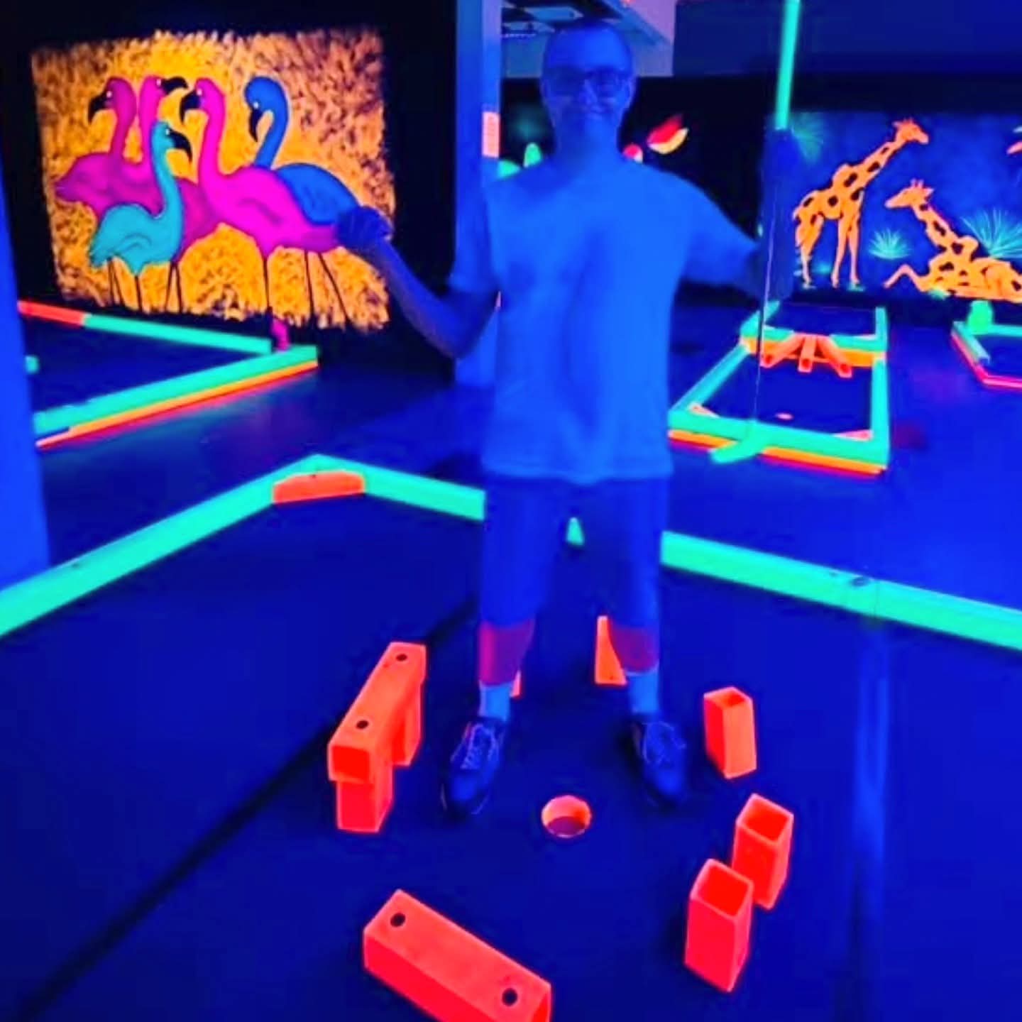 2025-09-30 1653 hours - Brady stands within 'Stonehenge' Scructure at Glow Golf