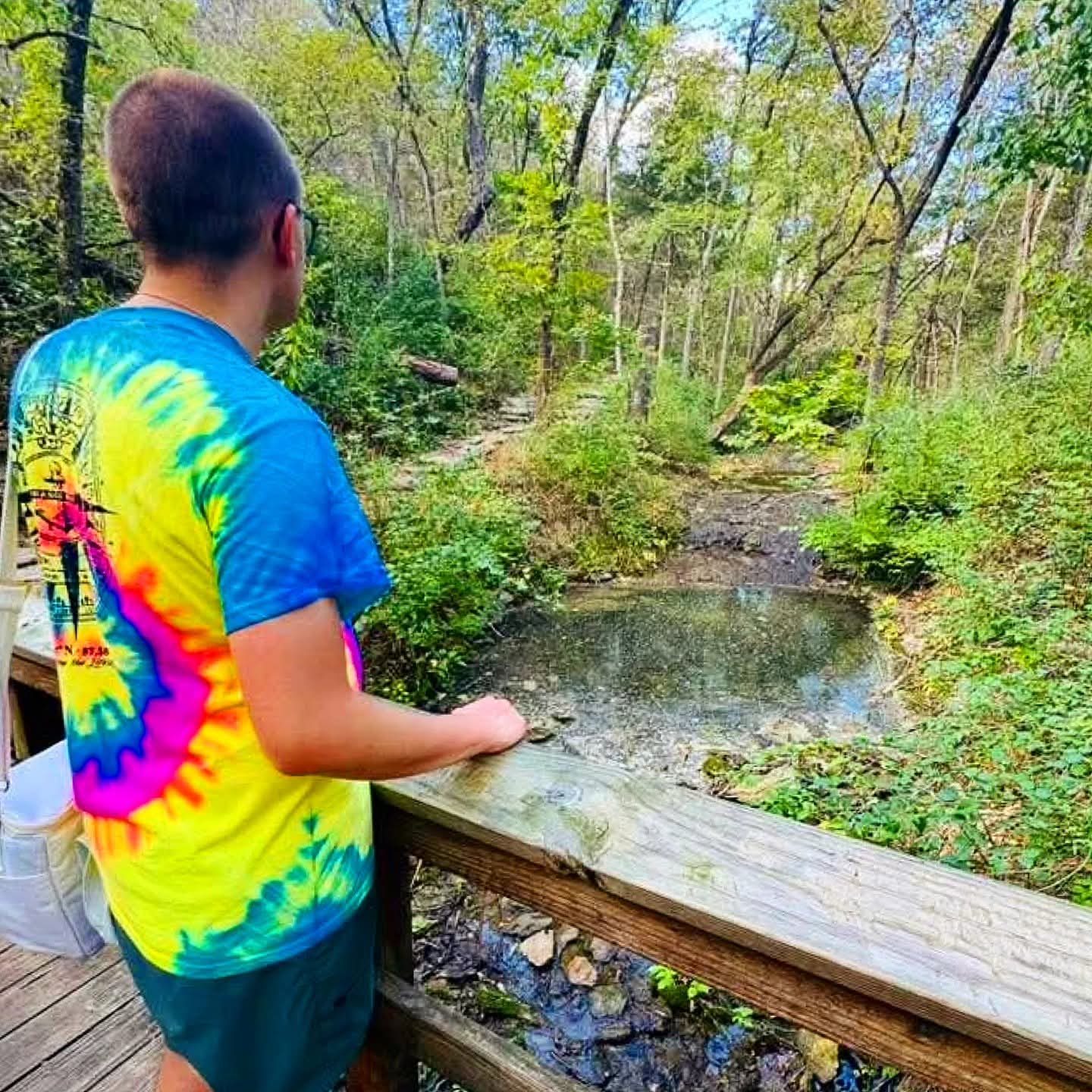 2025-10-06 1549 hours - Brady admires the Creek from Long Trail at Springfield Nature Center