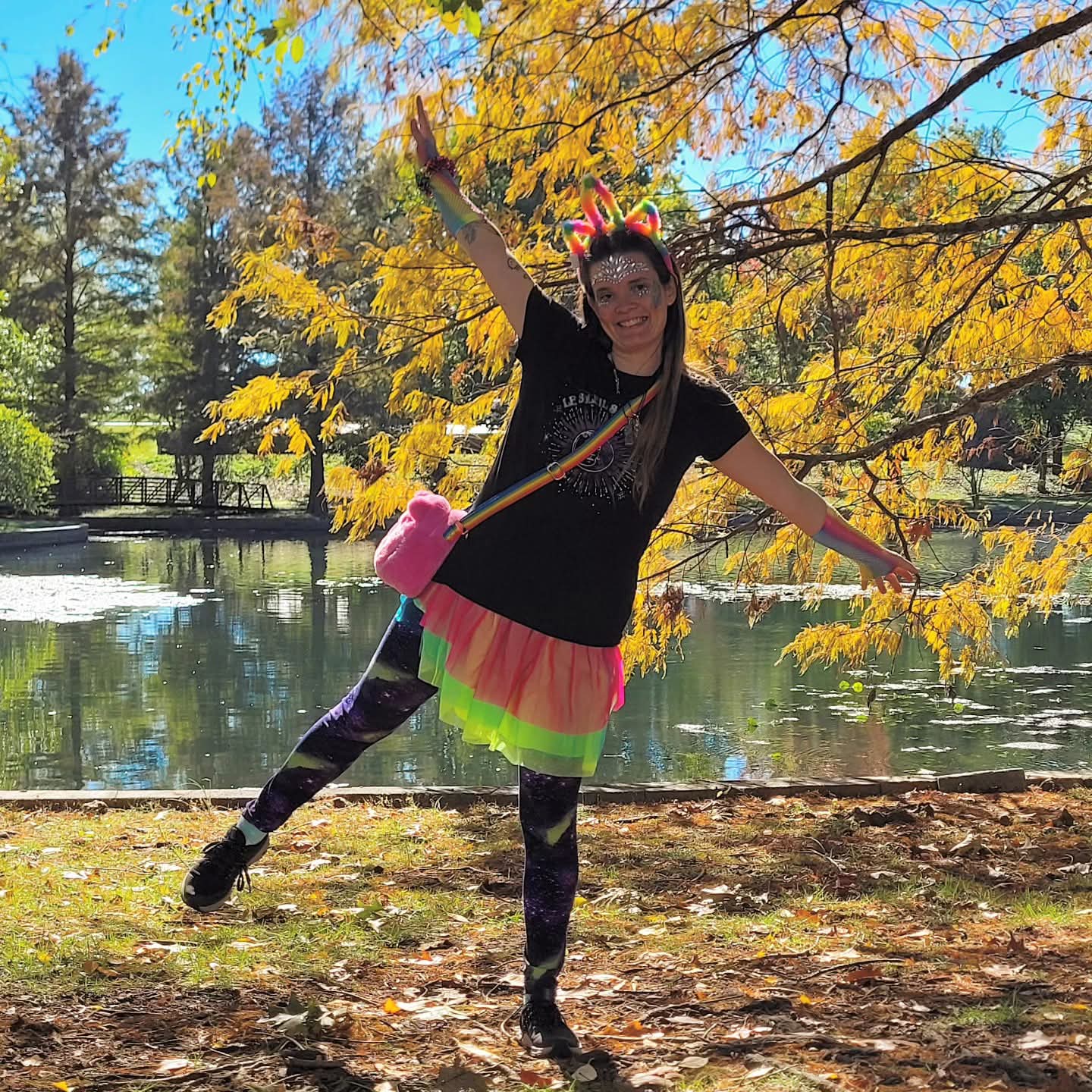 2025-10-31 1253 hours - Rainbow Unicorn Haley next to a Yellow-Orange Tree at Schaible Lake Park on Halloween MMXXV